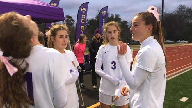 The Byrd soccer braintrust discusses options during halftime of Wednesday's 2-1 LHSAA playoff game against Dominican.