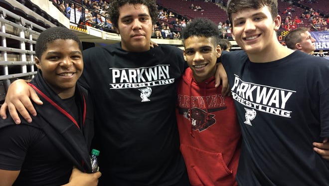 Parkway's Terrence Murray, Dez Eloph, Darryl Nicholas and Peyton Miller celebrate Eloph's win Friday afternoon in the LHSAA state wrestling meet.