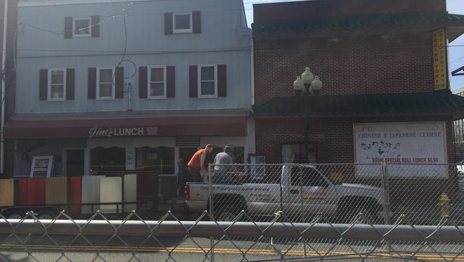 Equipment is removed Thursday from Jim's Lunch, at 105-107 E. Main Street in Millville.