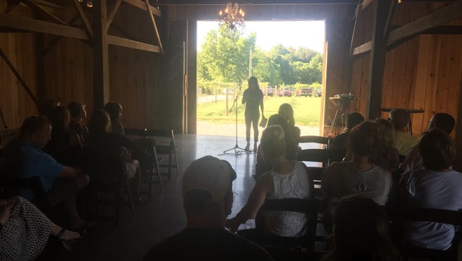 Katy Groves Mussat speaks to Farmer & Frenchman supporters Thursday night at the winery.