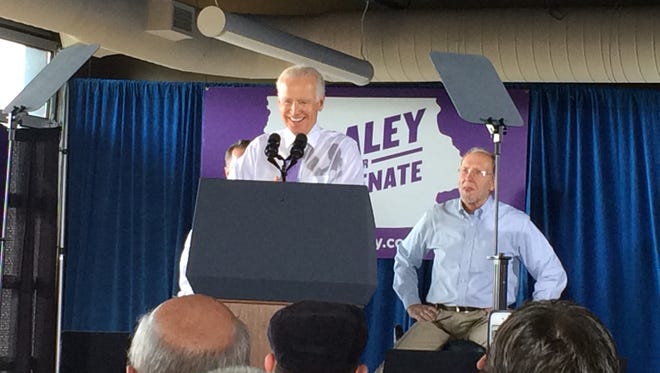 Vice President Joe Biden headlines a rally with Bruce Braley and Dave Loebsack, right, in Davenport.