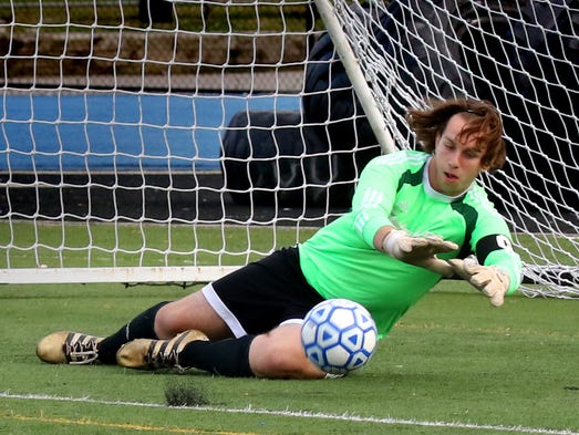Cedarburg's Jacob Jessel blocks a Whitefish Bay shot
