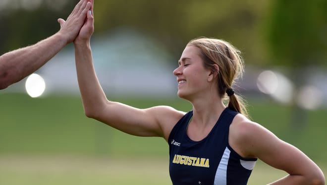 Augustana's Ellie Rew receives a high five after competing in the college women's javelin field event during Howard Wood Dakota Relays on Friday, May 6, 2016.