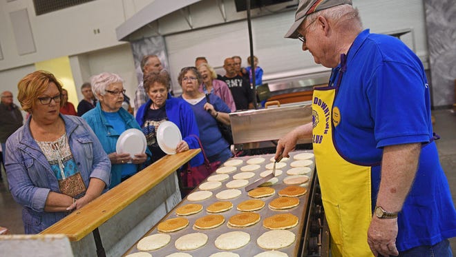 Harry Engberg, with Sioux Falls Downtown Lions, works on a batch of pancakes during the 61st Sioux Falls Downtown Lions Pancake Days fundraising event Tuesday, April 18, 2017, at the Sioux Falls Convention Center in Sioux Falls. Sunshine Cady, with Sioux Falls Downtown Lions, said they can cook 10,560 pancakes per hour on their 11 grills. Pancakes will be served from 6 a.m. to 8 p.m. Wednesday at the Sioux Falls Convention Center to finish of the event. 
