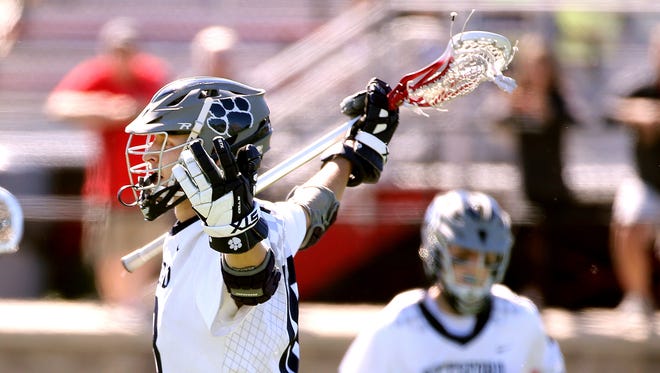 Pittsford's Colby Barker celebrates a first-quarter goal against Baldwinsville in the Class A state semifinal.