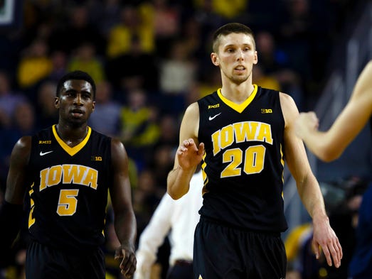 Iowa Hawkeyes guard Anthony Clemmons (5) and forward