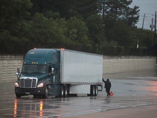 A truck sits stranded after breaking down on Interstate