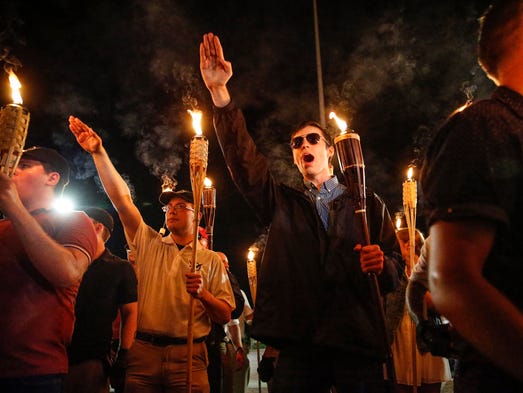 Multiple white nationalist groups march with torches