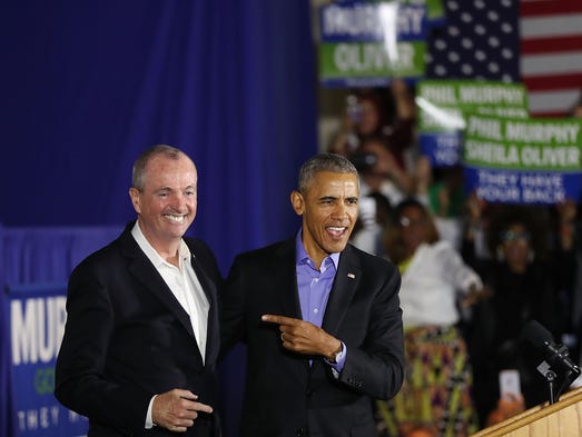 Obama stands on stage with Democratic candidate Phil