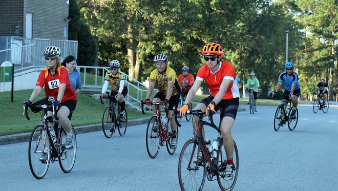 Cyclists make their way to the starting line Saturday during the 16th annual Bagels and Bluegrass Bicycle Century Tour, which began on the campus of Jackson State Community College.