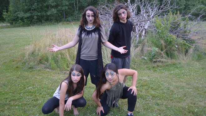 Front, from left: Amy Merena and Lily Brown as hyenas. Top, from left:, Sierra Aguiar as Scar and Robert Russell and ensemble member.