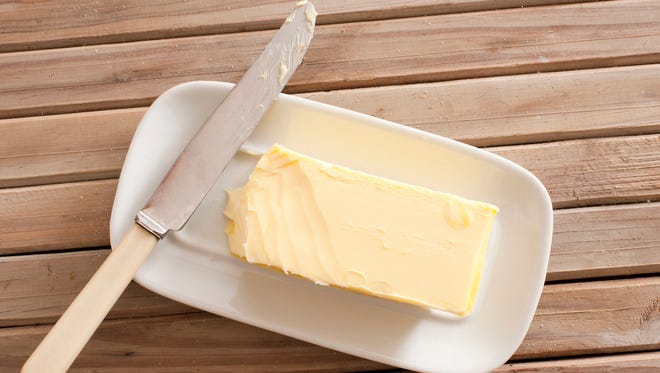 Stick of butter with knife.