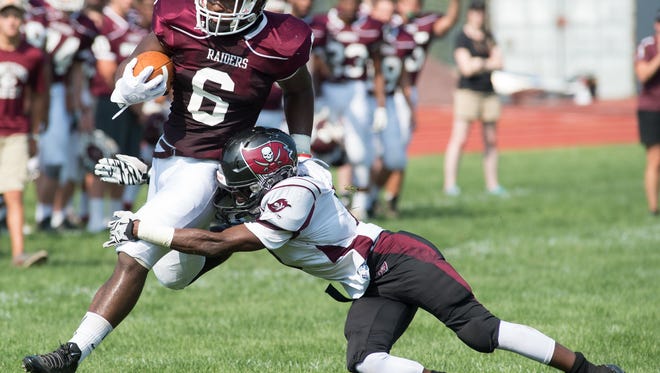 Concord's Grahm Roberts (6), shown here against Caravel's Mandela Montgomery, has rushed for more than 500 yards in the Raiders' first three games.