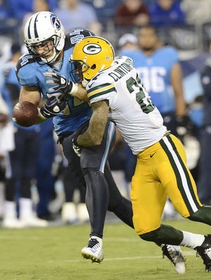 Green Bay Packers free safety Ha Ha Clinton-Dix (21) breaks up a pass intended for Tennessee Titans tight end Taylor Thompson (84) in the third  quarter of a preseason NFL football game Saturday, Aug. 9, 2014, in Nashville, Tenn. (AP Photo/Mark Zaleski)