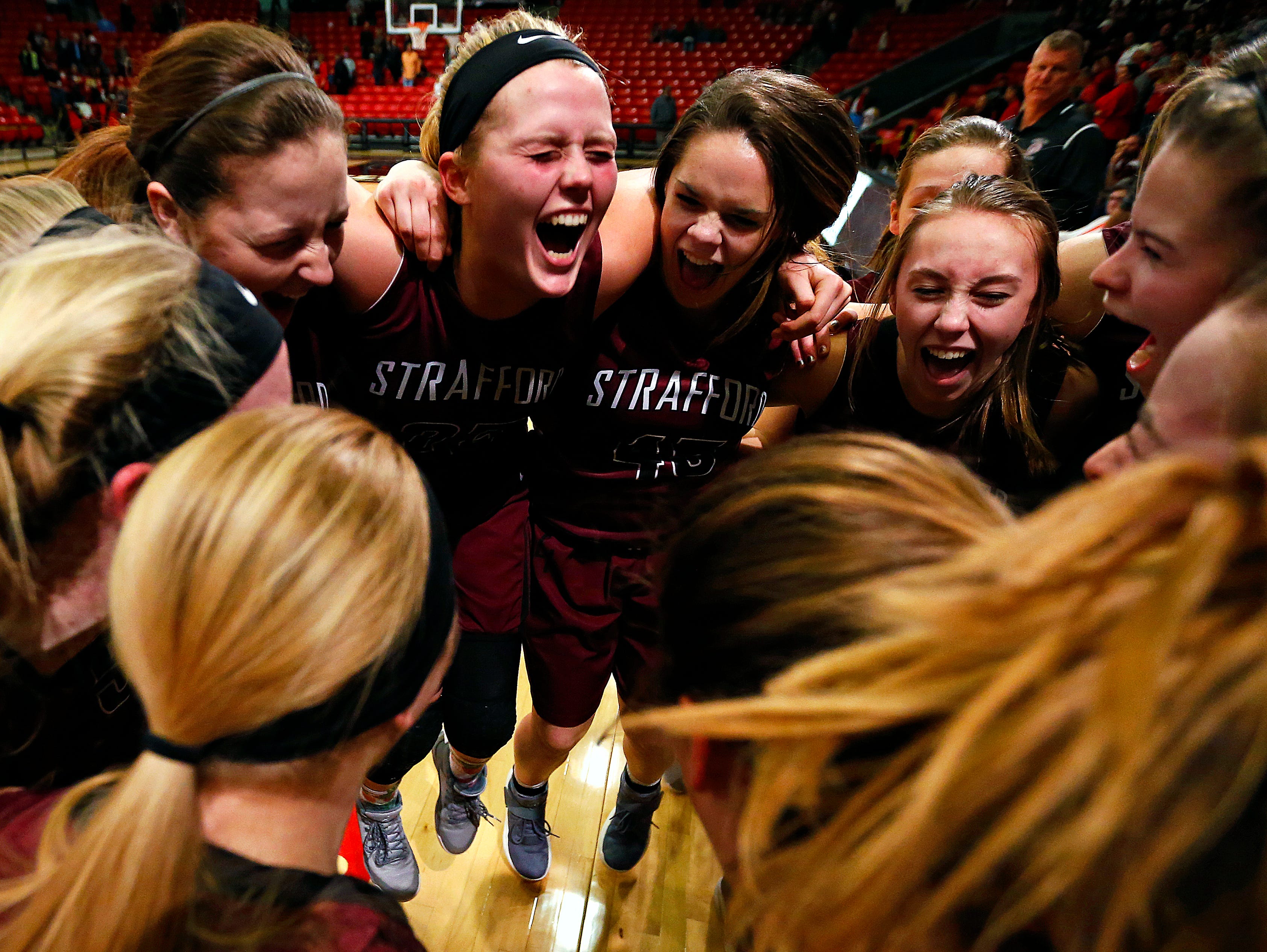 Strafford players celebrate after the end of the MSHSAA Class 3 quarterfinal game between the Strafford High School Lady Indians and the Southern Boone High School Eagles at O'Reilly Family Event Center in Springfield, Mo. on March 4, 2017. Strafford won the game 61-34.