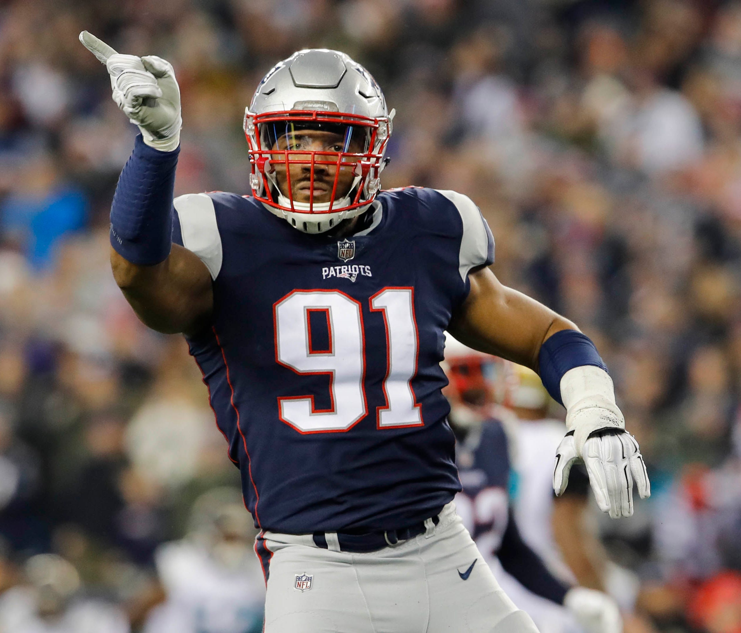 New England Patriots defensive end Deatrich Wise (91) reacts during the third quarter against the Jacksonville Jaguars in the AFC Championship Game at Gillette Stadium.
