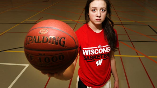 MaKayla Scheuer, a point guard with the Marshfield High School girl's basketball team, poses for a portrait on February 22, 2016. 