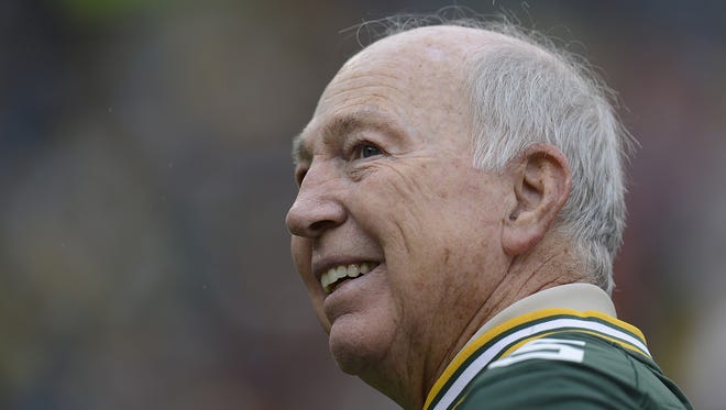 Green Bay Packers great Bart Starr smiles as he looks at the crowd during alumni day at the game against Washington at Lambeau Field on Sept. 15, 2013.