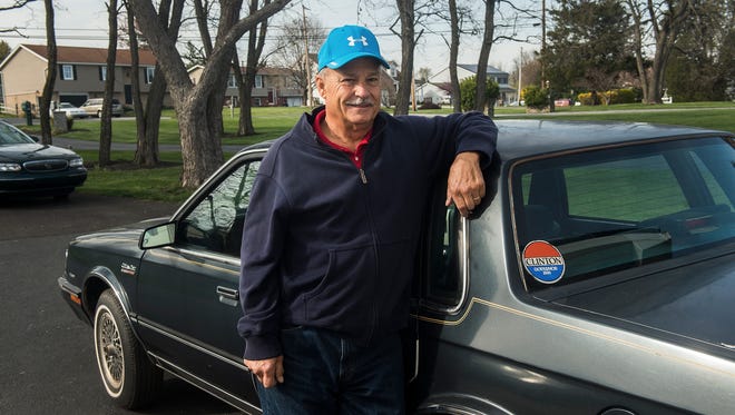 Gettysburg resident Mike Lawn stands next to the car formerly owned by Hillary Clinton on April 6, 2016. 