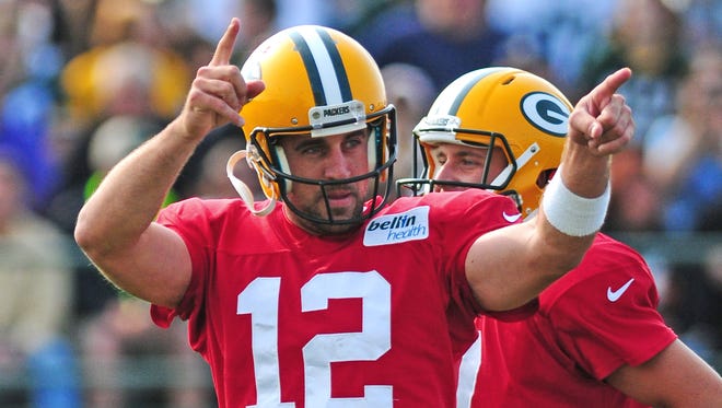 Green Bay Packers quarterback Aaron Rodgers gestures during Monday's training camp practice at Ray Nitschke Field.