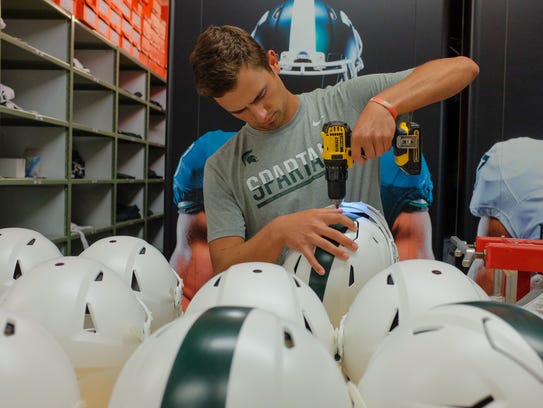 Michigan State football equipment staff help Spartans dress for success