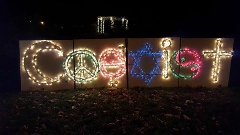 A sign at the holiday display at Gypsy Hill Park said "Coexist," before it was unplugged.