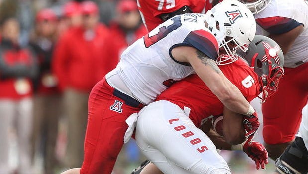 UA linebacker Scooby Wright makes a tackle in the New Mexico Bowl.