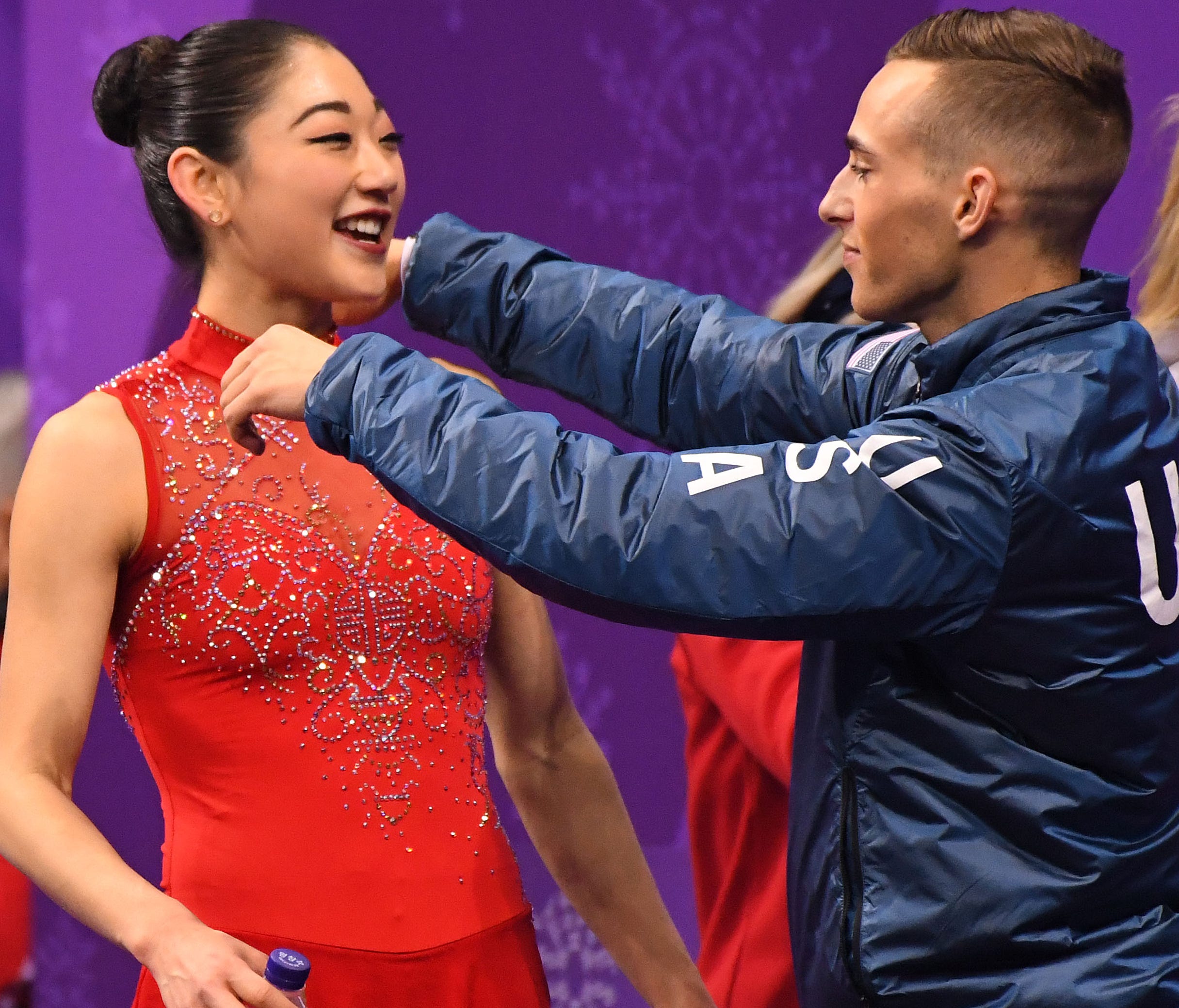 Mirai Nagasu hugs friend and teammate Adam RIppon after her historic skate at the Olympics on Monday .
