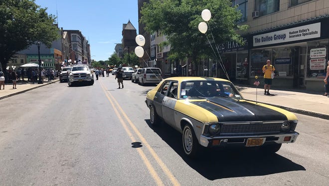 A car leads the procession during the 15th annual Hudson Valley Father's Day Parade in Poughkeepsie Saturday.