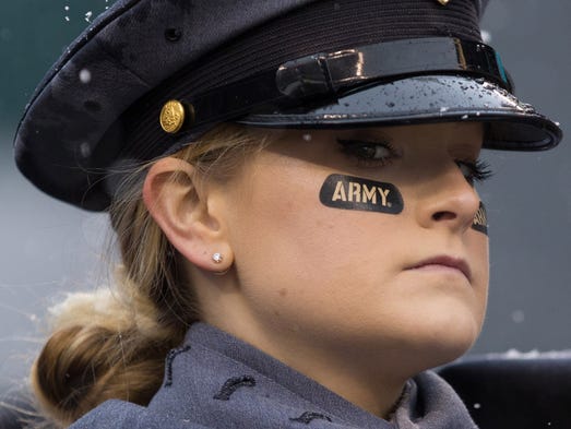 A West Point cadet glances over before the 118th Army