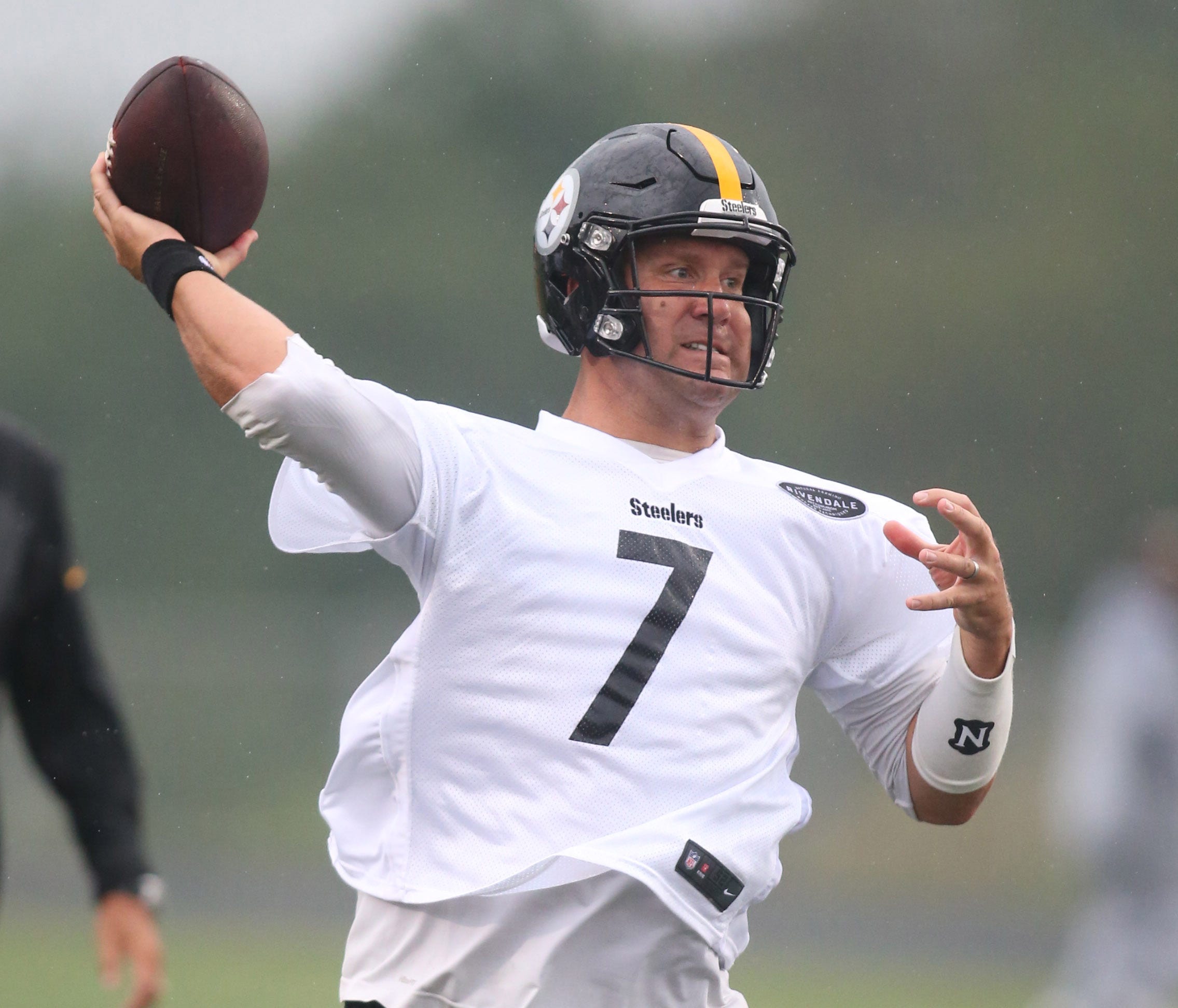 Jul 28, 2017; Latrobe, PA, USA;  Pittsburgh Steelers quarterback Ben Roethlisberger (7) participates in drills during training camp at Greater Latrobe area high school. Inclement weather forced the practice to be moved from Saint Vincent College. Man
