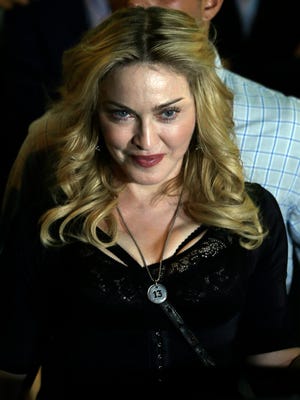 Madonna leaves after visiting the 'Hard Candy Fitness' center in Rome on Aug. 21.