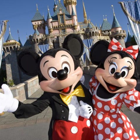 Mickey and Minnie Mouse greeting visitors to Disne
