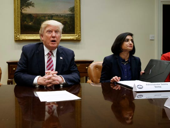 Seema Verma, right, attends a meeting with President