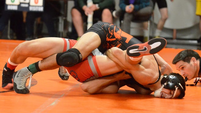 Fernley senior Dillon Maguin, returning after a head injury, has his opponent all wrapped up and goes for a pin at Jan. 10’s Douglas Tournament.