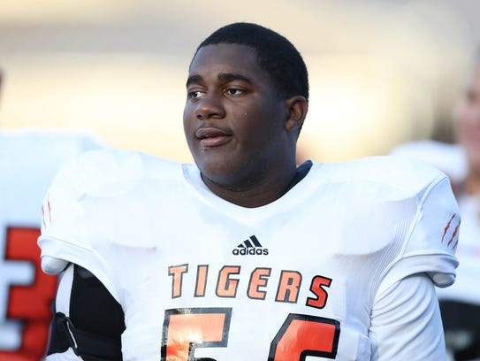 Belleville's Devontae Dobbs warms up before Belleville's