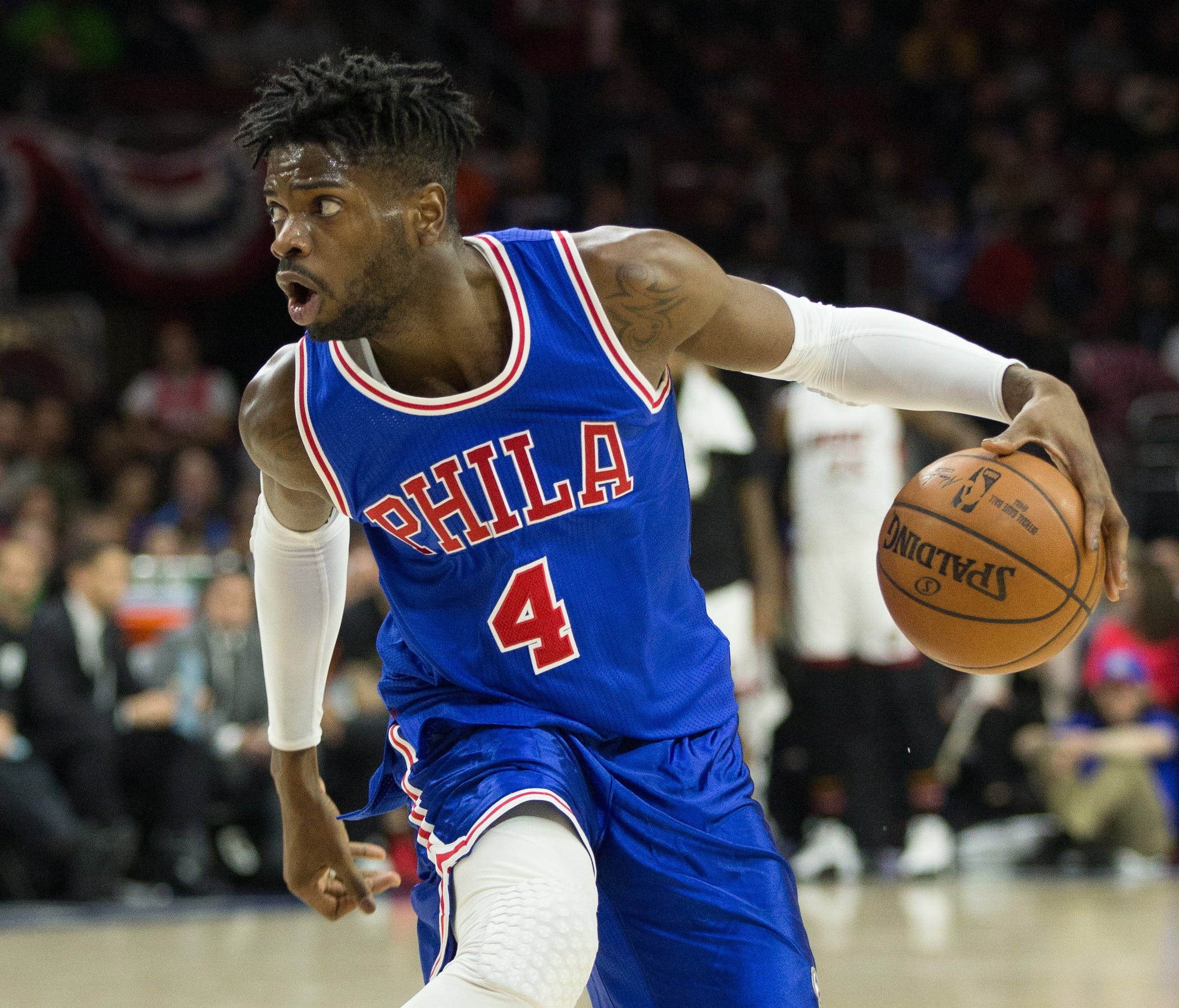 Philadelphia 76ers forward Nerlens Noel (4) dribbles against the Miami Heat during the second quarter at Wells Fargo Center.