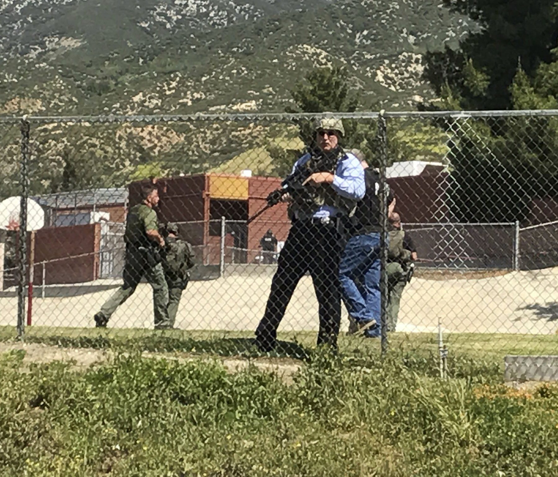 Emergency personnel respond to a shooting inside North Park School Elementary School in San Bernardino, Calif.