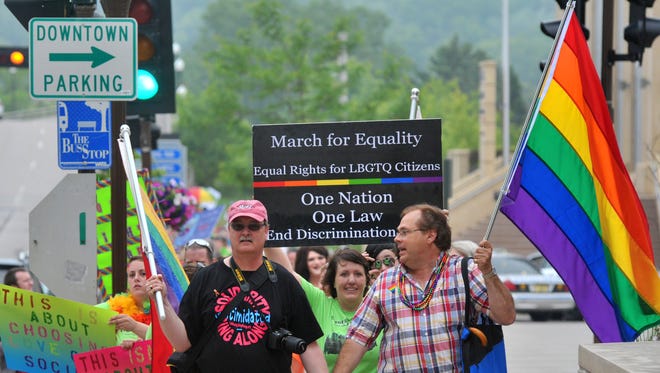People participate in the March for Equality, showing support for gay rights and marriage, from Marathon Park to The 400 Block in downtown Wausau in June 2014.