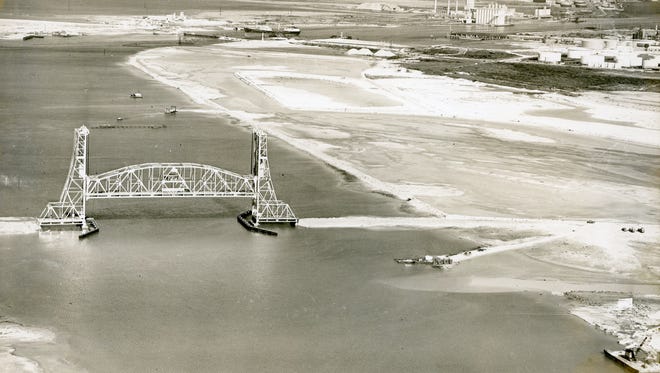 Caller-Times fileThe Tule Lake Lift Bridge carried rail and vehicle traffic over the upper harbor at the Port of Corpus Christi. The bridge, seen here in 1959, the same year it opened, cost about $6.3 million. It was closed to vehicle traffic in 2006, rail traffic ceased in 2007 and in 2008 the span was removed and the upper support towers demolished with explosives.