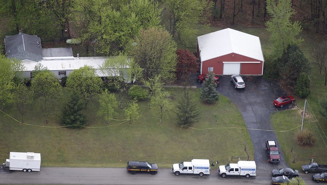 An aerial view of one of the locations in which eight people died in an "execution-style" killing Friday, April 22, 2016, in Piketon, Ohio. State and local officials are conducting investigations throughout the Ohio town.
