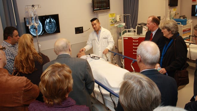 Dr. Justin Chu explains features of one of the fully functional mannequins in the new Jane and Peter Galetto Jr. Simulation Center at Inspira Medical Center Vineland during a dinner and tour event for donors to Inspira Foundation Cumberland/Salem.