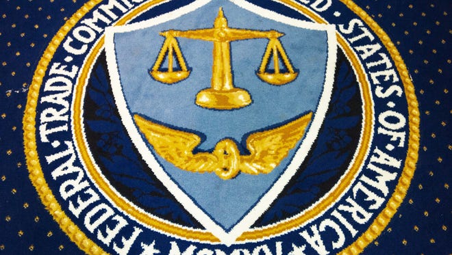 The logo of the Federal Trade Commission is seen sewn into the carpet in their Commissioner's Conference Room inside the FTC headquarters in Washington, D.C.