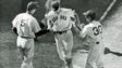 1941: Ted Williams is greeted at home plate by teammate