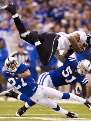 Marcedes Lewis, of Jacksonville, is spun around by