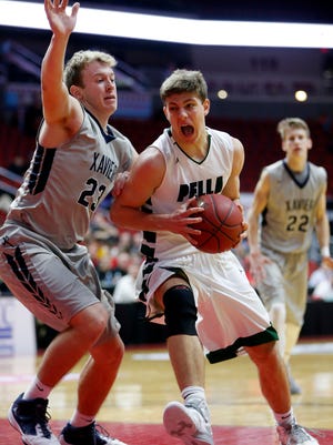 Will Warner of Pella drives to the hoop in the boys 3A semifinal game against Xavier Thursday, March 10, 2016.