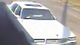 Still frame image of white Chevrolet Caprice sedan police believe was involved in Dec. 29 hit and run.