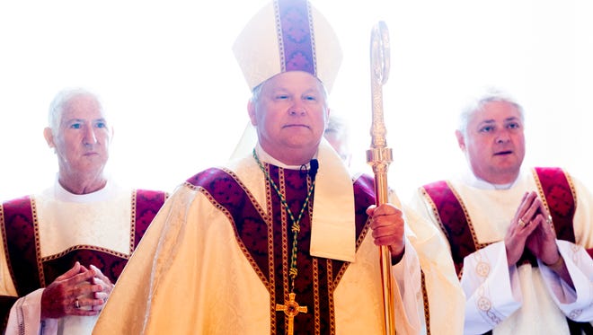 Knoxville Bishop Richard F. Stika enters through the front doors at the Mass and Rite of Dedication of the Cathedral of the Most Sacred Heart of Jesus in Knoxville, Tennessee on Friday, January 1, 2016. After nearly three years of construction, the 28,000-square-foot domed cathedral opened to a noon mass attended by more than 1,000 people.