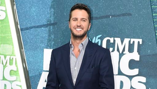 FILE - In this June 10, 2015 file photo, country singer Luke Bryan arrives at the CMT Music Awards in Nashville, Tenn. Bryan said he misspoke when he differentiated himself from outlaw country musicians like Willie Nelson, Merle Haggard and Waylon Jennings by saying he doesn’t do drugs. Bryan, the reigning Country Music Association and Academy of Country Music entertainer of the year, apologized for how the comments appeared in an article on the online magazine, Hits Daily Double. (Photo by Sanford Myers/Invision/AP, File)