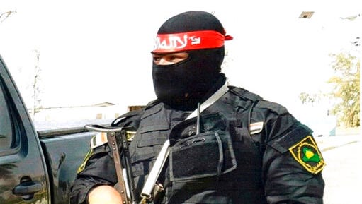 This undated photo obtained by the Associated Press shows an Iraqi bodyguard hired by Sallyport Global to protect VIPs. When a Toyota SUV was stolen from Balad air base, he became the chief suspect and was linked to a dangerous Iran-backed militia and was viewed by investigators as “a hard-core recruit to become a terrorist who poses a serious threat to all personnel on this base.”